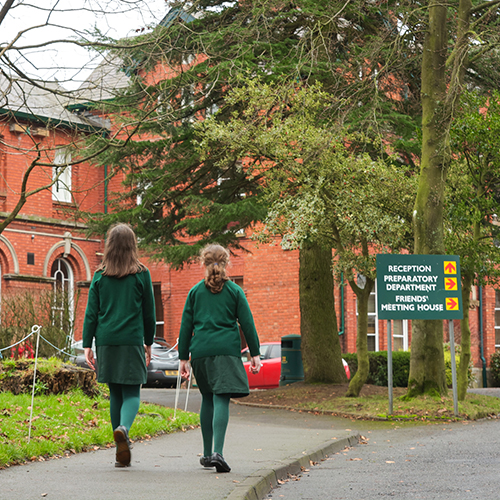 Students walking in front of hte school