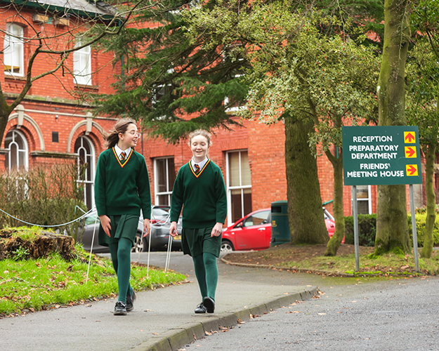 Students walking in front of school building