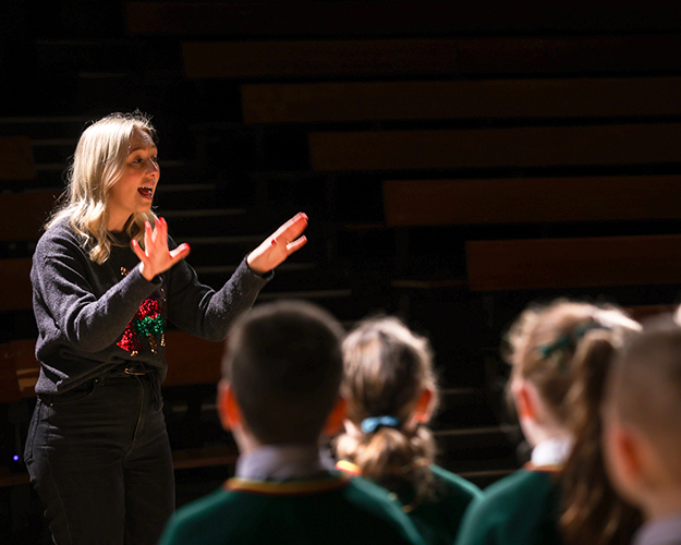 Teacher talking to students