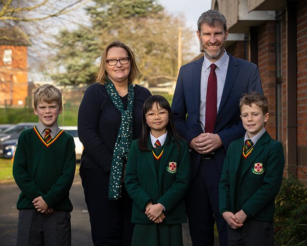 Principals and students posing for a photo