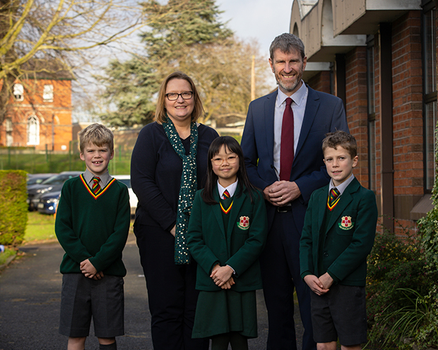 Principals and students posing for a photo